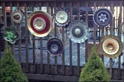 These "flowers" were made by gluing together stacks of mismatched plates and bowls. Photo by Louise LePierres