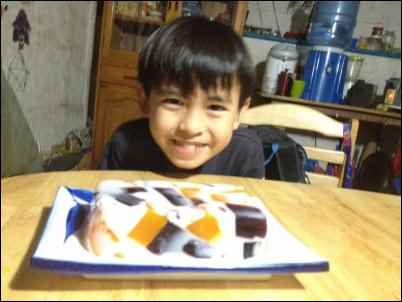 Unschooling gave them more time to get comfortable in the kitchen.  Kaaro with his cathedral cake.